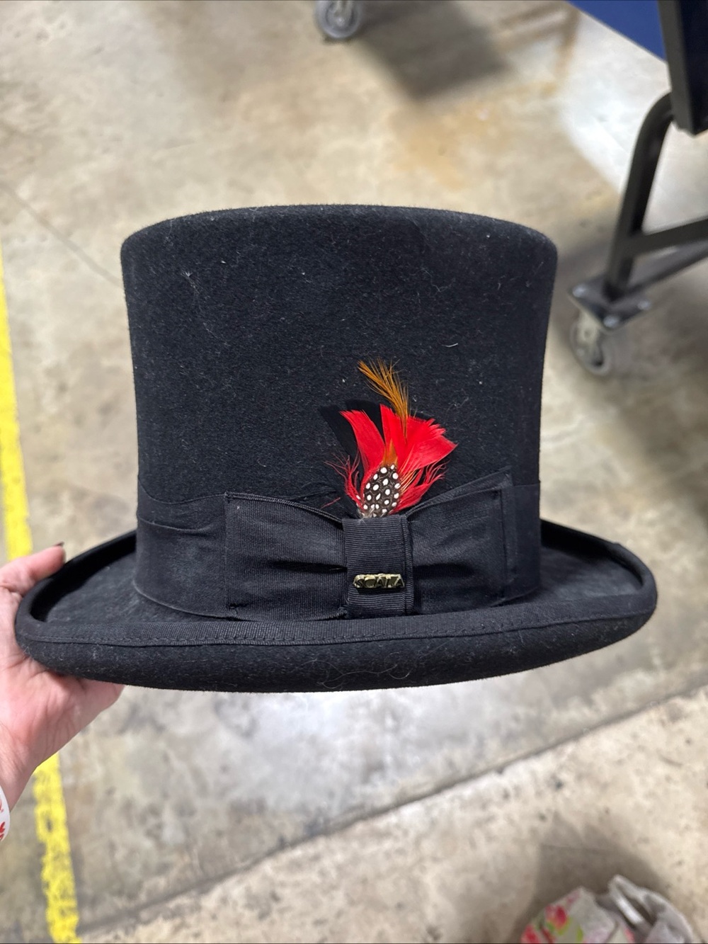 Scala ”Mad Hatter” Black Top Hat with Red & Orange Feather Accent